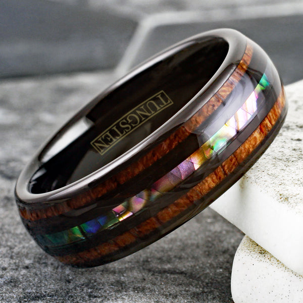 Brilliant Polished Black Tungsten Low Dome Ring with Iridescent Abalone Inlay Between Two Black Bands And Koa Wood Inlays.