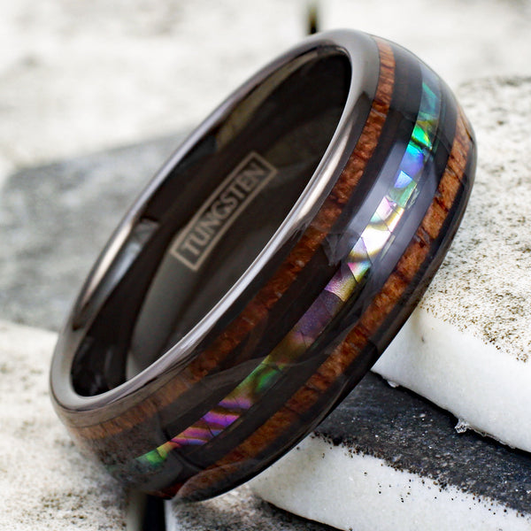 Brilliant Polished Black Tungsten Low Dome Ring with Iridescent Abalone Inlay Between Two Black Bands And Koa Wood Inlays.