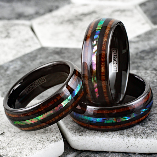 Brilliant Polished Black Tungsten Low Dome Ring with Iridescent Abalone Inlay Between Two Black Bands And Koa Wood Inlays.