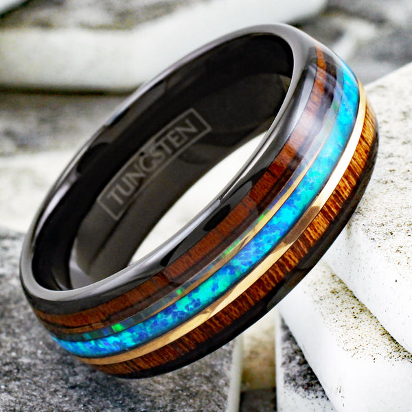 Gorgeous Polished Black Tungsten Low Dome Ring with Iridescent Man-Made Crushed Hawaii Blue Opal Inlay Between Two Rose  Surrounded By Koa Wood Inlays.