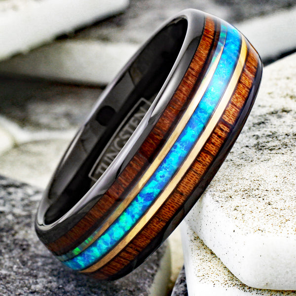 Gorgeous Polished Black Tungsten Low Dome Ring with Iridescent Man-Made Crushed Hawaii Blue Opal Inlay Between Two Rose  Surrounded By Koa Wood Inlays.