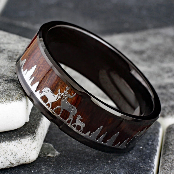 Beautiful Polished Finish Black Flat Band Tungsten Ring With Silver Deer Family In Forest Scene Overlay On Wood Inlay.