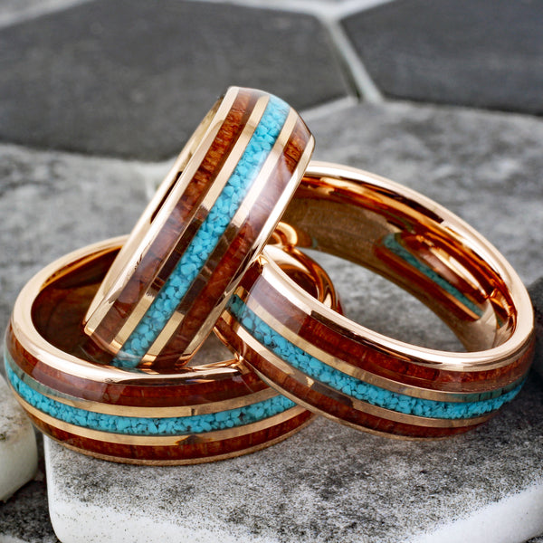 Gleaming Polished Rose Gold Low Dome Tungsten Ring with Crushed Blue Turquoise Inlay Between Koa Wood Inlays.