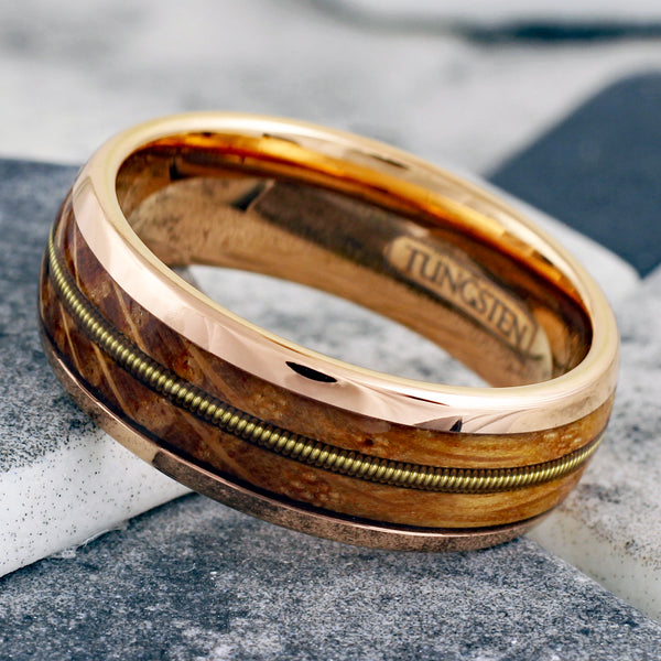 Glorious Polished Rose Gold Tungsten Low Dome Ring with Cool Genuine Guitar String Between Whiskey Barrel Oak Wood Inlays.
