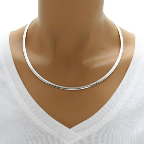Sterling Silver Domed Reversible Gold and Silver Omega Chain Necklace 4mm. Available in 16" Lengths.