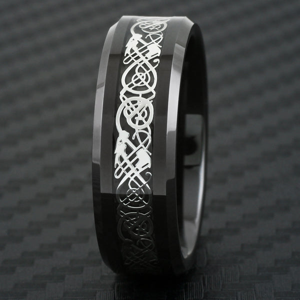 Black tungsten carbide ring w/ silver Celtic dragon on black faux carbon fiber inlay | Black front photo