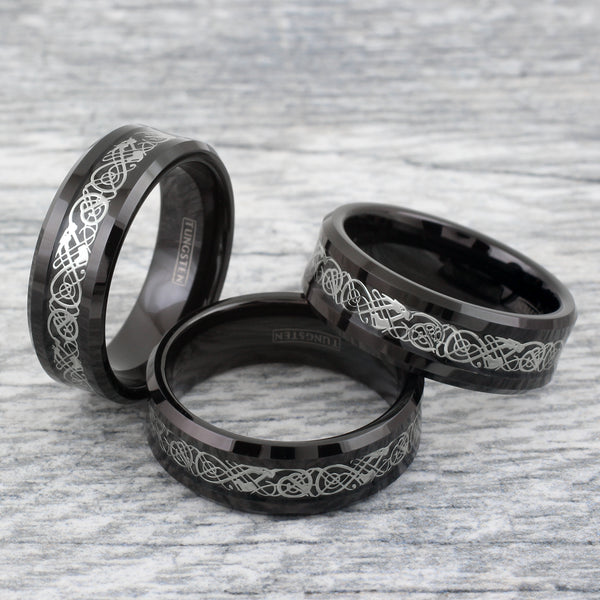Black tungsten carbide ring w/ silver Celtic dragon on black faux carbon fiber inlay | Group photo