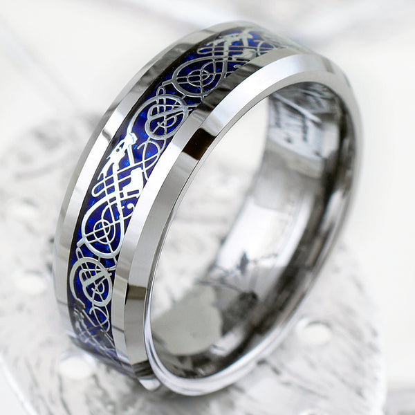 Polished silver tungsten carbide ring w/ silver Celtic dragon on sapphire blue faux carbon fiber inlay | Tilt leaf Photo