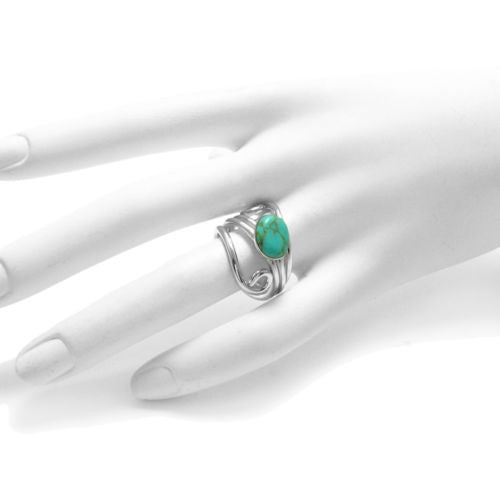 Art Deco swirly wrap ring with oval turquoise. Wholesale sterling silver rings. Hand photo.