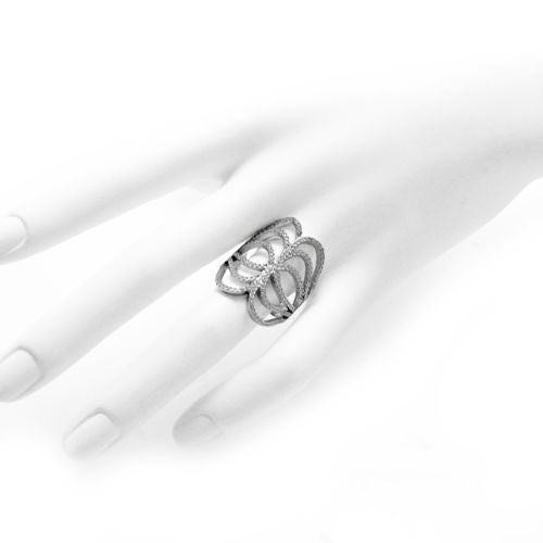 Artist interpretation of butterfly wings embellished with CZs. Wholesale sterling silver rings. Hand photo.