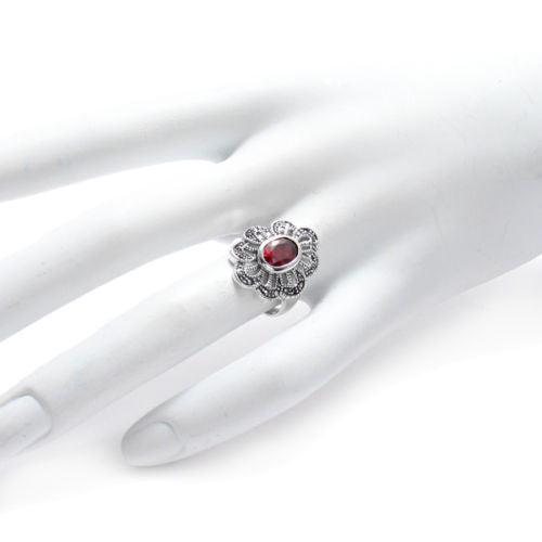 Marcasite flower ring with blood red CZ. Wholesale sterling silver rings. Hand photo.