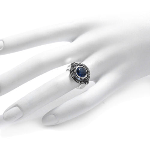 Elegant oval marcasite ring with deep blue CZ stone. Wholesale Sterling Silver Rings. Hand Photo.