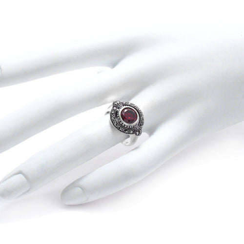 Elegant Marcasite Oval Ring with Red CZ Center Stone. Wholesale Sterling Silver Rings. Hand photo.