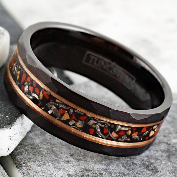 Spectacular Faceted Brushed Finish Black Tungsten Flat Band Ring with Crushed Faux Dinosaur Bone and Black Faux Meteorite Inlay between Rose Gold Stripes.