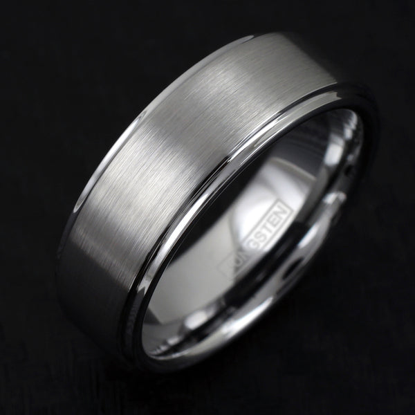 Silver tungsten ring w/ brush finish outer band & polished stepped edges | Black tilted photo