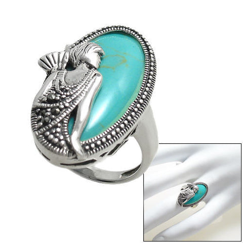 Flapper with fan in turquoise and silver. Wholesale sterling silver rings. Combo photo.