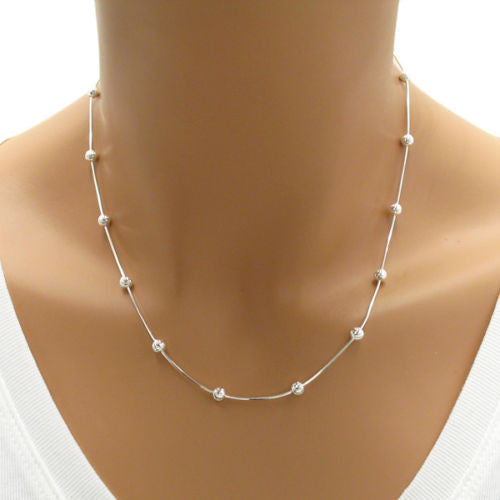 Dazzling Sterling Silver Diamond Cut Snake Chain Necklace with Laser Cut Beads. Available in 2 Lengths.