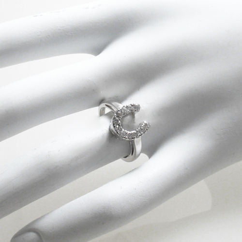 Sparkling CZ encrusted lucky horseshoe ring | Wholesale sterling silver rings - jewelry | Hand photo