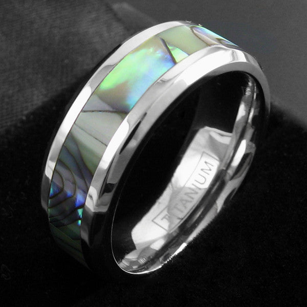 Dazzling mirror polished titanium ring with beautiful abalone inlay | Wholesale Jewelry | Black background photo