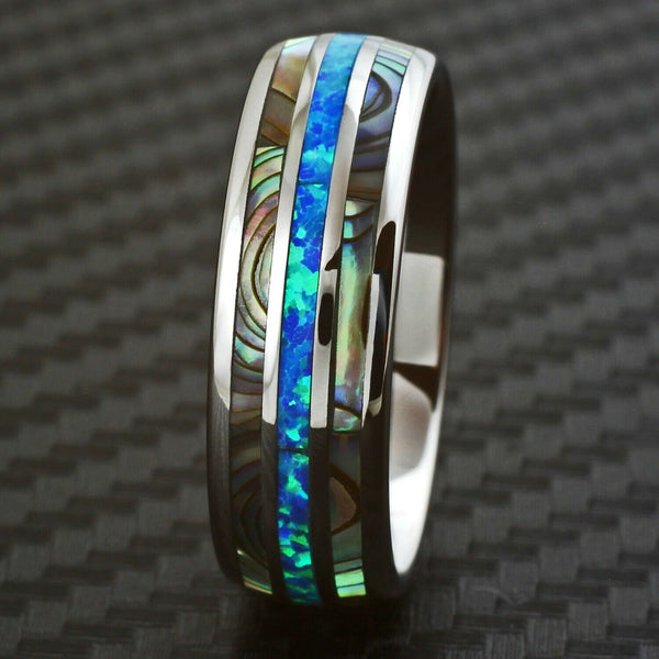 Polished silver low dome tungsten carbide band ring w/ created Hawaiian blue opal & abalone inlays | Front photo