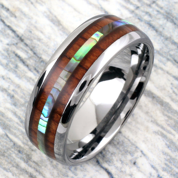 Silver tungsten dome ring w/ abalone inlay between Koa wood inlays | Marble photo