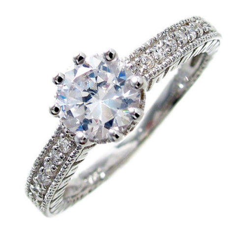 Round cut CZ engagement ring w/ 8 micro pave CZ accents | Wholesale 925 Sterling Silver Rings - Jewelry | Diagonal photo