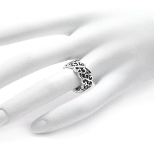 Band ring composed of crossed scrolls repeated throughout the band. Wholesale Sterling Silver Rings. On hand.