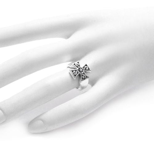 Brilliant Maltese cross ring with sharp lines and angles. On hand.