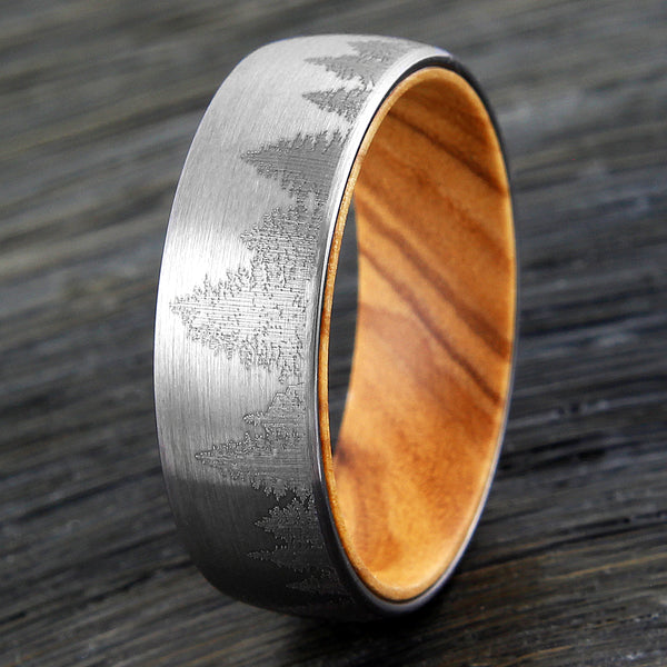 Brushed Finish tungsten carbide band ring w/ etched forest scene & olive wood inner band | Wood upright photo