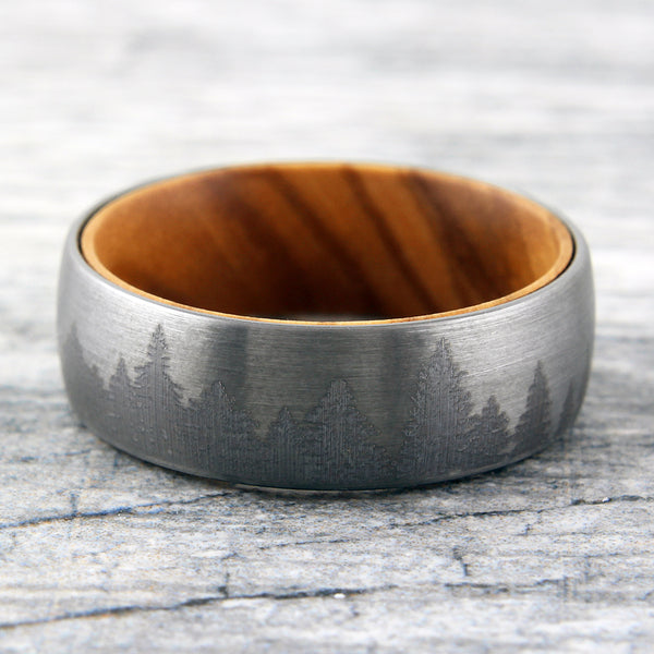 Brushed Finish tungsten carbide band ring w/ etched forest scene & olive wood inner band | Marble flat photo